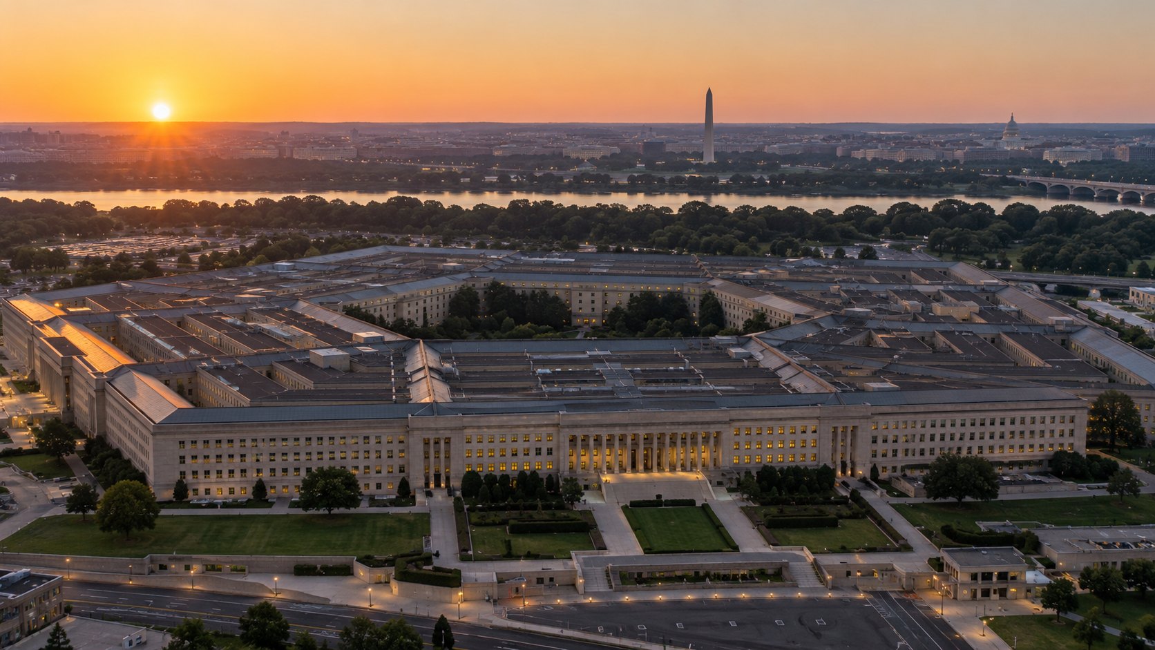 Ilustración editorial generada con IA: vista aérea del Pentágono al amanecer, con el río Potomac, el Monumento a Washington y el Capitolio en el horizonte; composición conceptual, no es una fotografía de un hecho real.