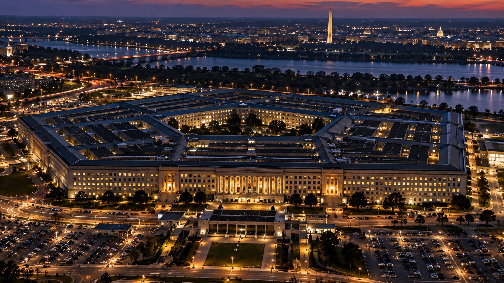 Ilustración editorial generada con IA: vista aérea del Pentágono, en Arlington, Virginia, al anochecer, con las oficinas iluminadas y Washington al fondo; no es una fotografía tomada el 30 de octubre.