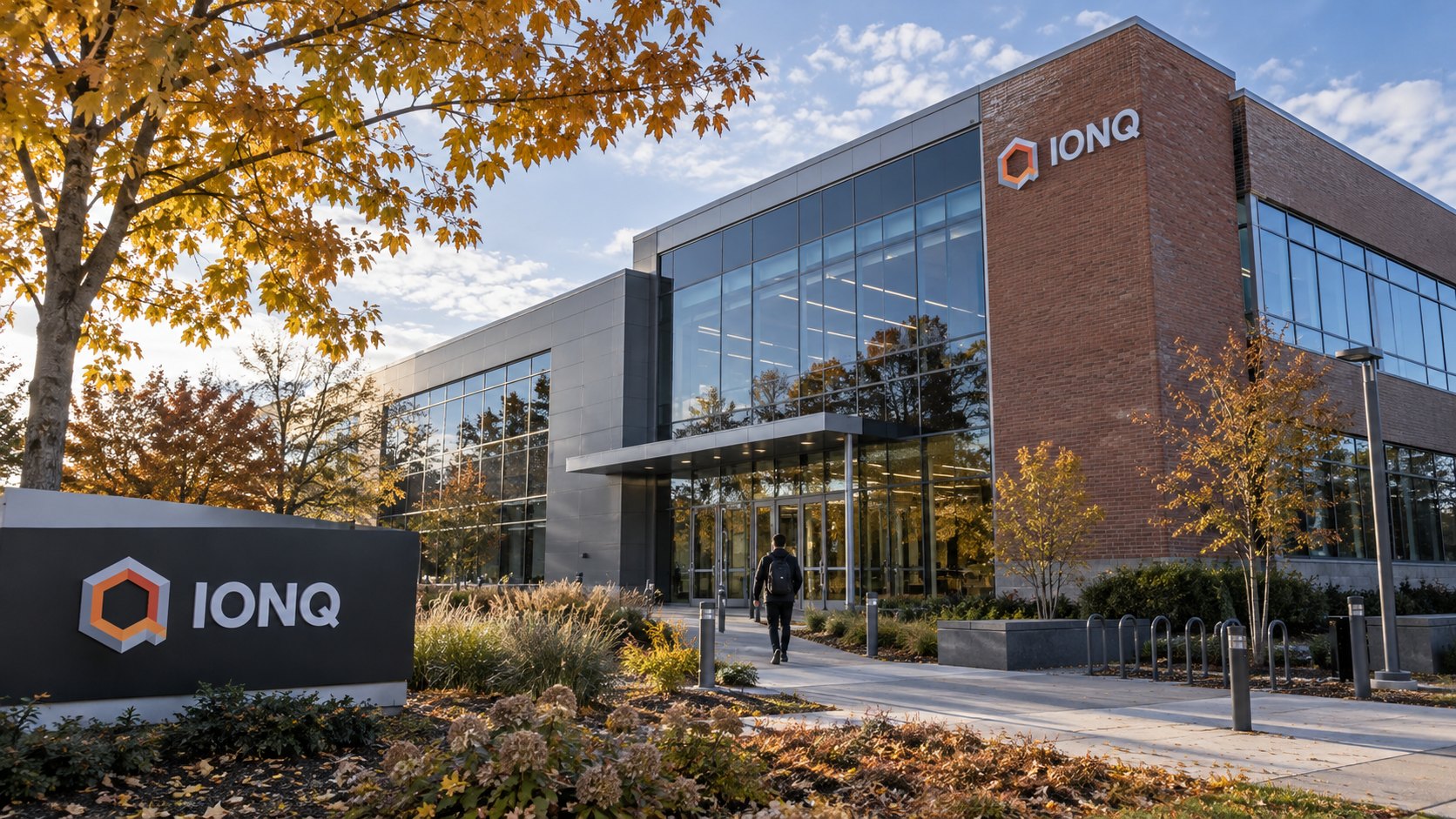 Ilustración editorial generada con IA: la fachada de la sede de IonQ en College Park, Maryland, con el logo de la empresa; composición conceptual, no es una fotografía del día.