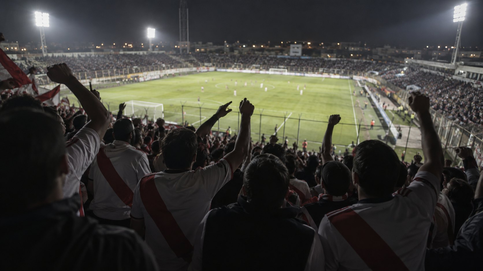Ilustración editorial generada con IA: hinchas con camisetas blancas con banda roja diagonal, de espaldas, alientan con los brazos en alto en la tribuna visitante de un estadio iluminado de noche; no es una fotografía del partido ni representa a personas reales.